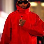 Lewis Hamilton was seen arriving in a flamboyant all-red outfit that caught the eye in the City of Lights