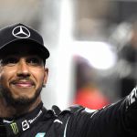 Lewis Hamilton waves to fans