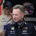 Christian Horner stands in his team garage during the third practice session on Friday