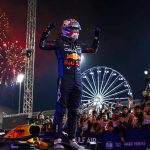 Max Verstappen celebrates standing on his car in Bahrain.